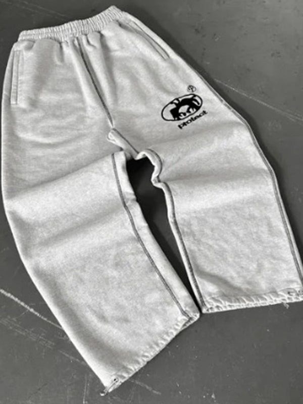 Solid-colored sweatpants with vintage print