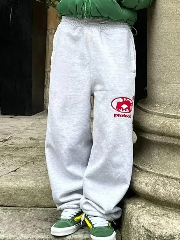 Solid-colored sweatpants with vintage print