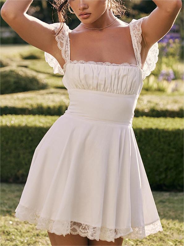 White mini dress with lace trim to tie at back