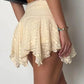 Cute structured pleated mini skirt with irregular mushroom hem and high waist