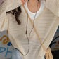 White vintage cut out knitted sweater with loose fit and V neck