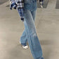 Blue vintage high rise boyfriend jeans with all over fringe design