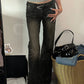 Dark vintage flared trousers with low waist and inserts