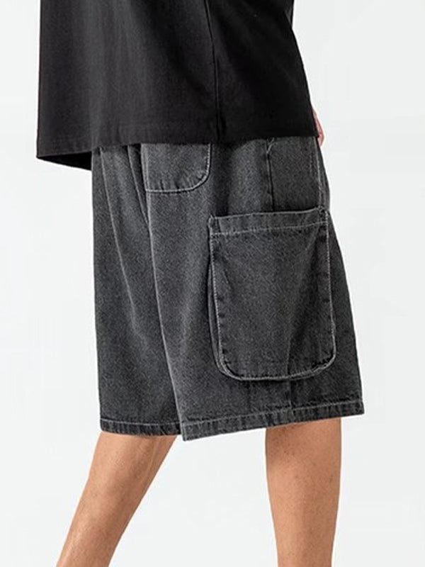 Dark grey vintage men's denim shorts with ripped pockets