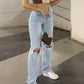 Light blue 2000s Y2k boyfriend jeans with ripped design