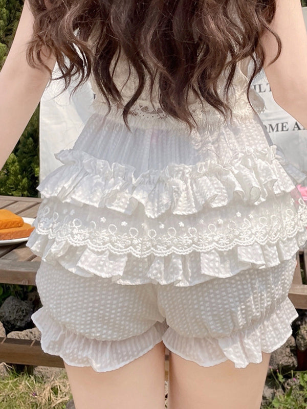 White Y2K shorts with multiple layers of lace and bows