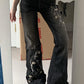 Black vintage slim fit flared jeans with floral embroidery
