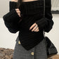 Black vintage sweater with off-the-shoulder hanky hem 