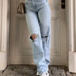 Light blue 2000s Y2k boyfriend jeans with ripped design