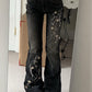 Black vintage slim fit flared jeans with floral embroidery