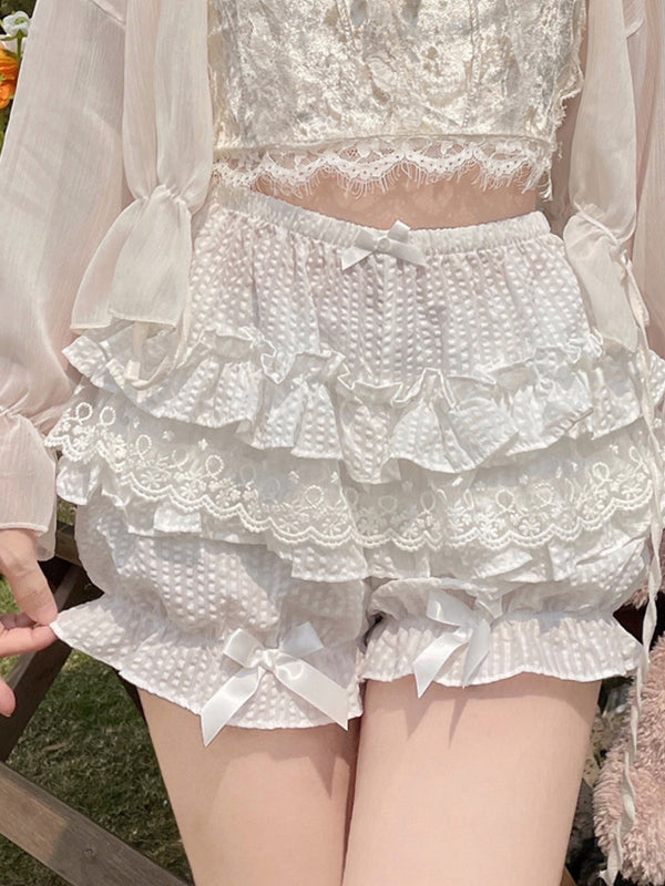 White Y2K shorts with multiple layers of lace and bows