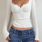 White basic rib knit top with button placket and long sleeves