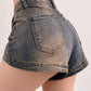 Blue vintage distressed denim shorts with washed effect