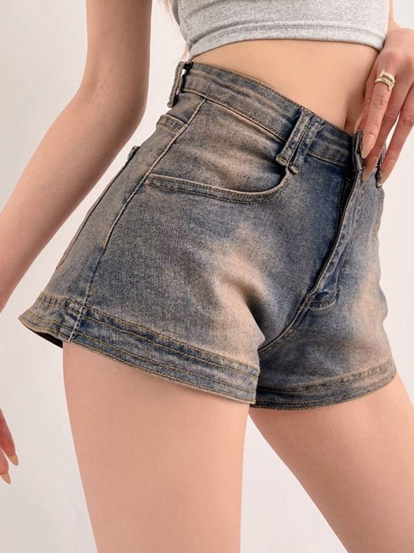 Blue vintage distressed denim shorts with washed effect