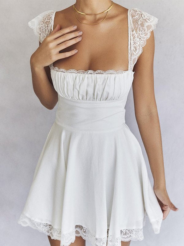 White mini dress with lace trim to tie at back