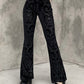 Black vintage flared trousers with embossed velvet and flared legs