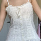 White vintage camisole with buttons and embroidered lace