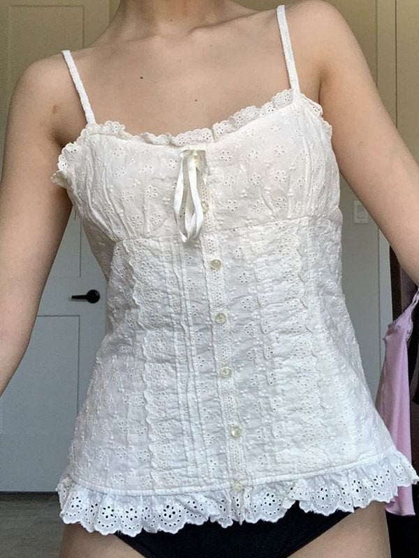 White vintage camisole with buttons and embroidered lace