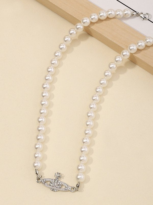 Vintage faux pearl necklace with planet detail