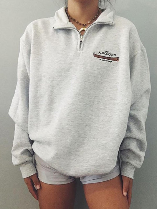 Gray retro sports sweatshirt with zip and printed slogan