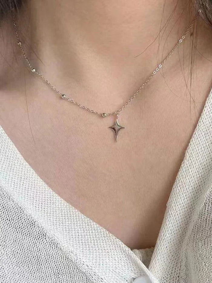 Vintage asymmetric necklace with star pendant