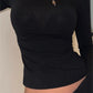 Black long sleeve top with backless slit