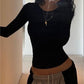 Black long sleeve top with backless slit