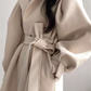 Coat with lapel collar, puff sleeves and belt
