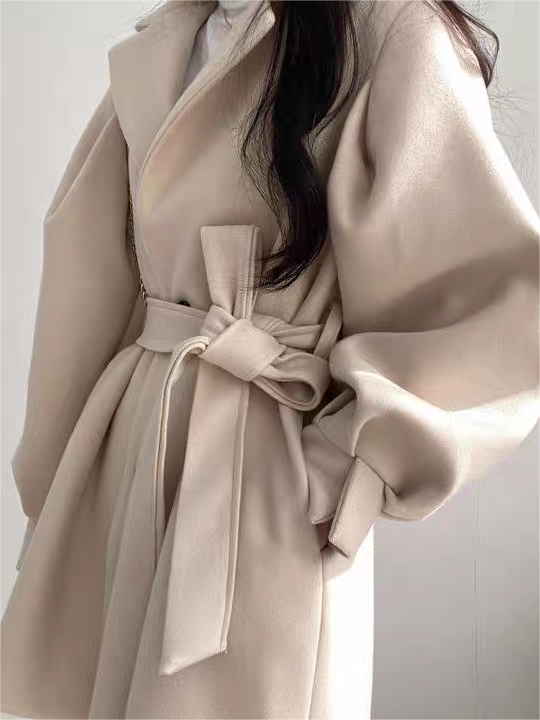 Coat with lapel collar, puff sleeves and belt