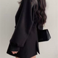 Coat with lapel collar, puff sleeves and belt