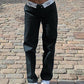 Dark straight leg trousers with a foldable waist