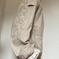 Light colored baggy parachute cargo pants with drawstring and low waist