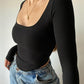 Asymmetric long sleeve crop top with scoop neckline