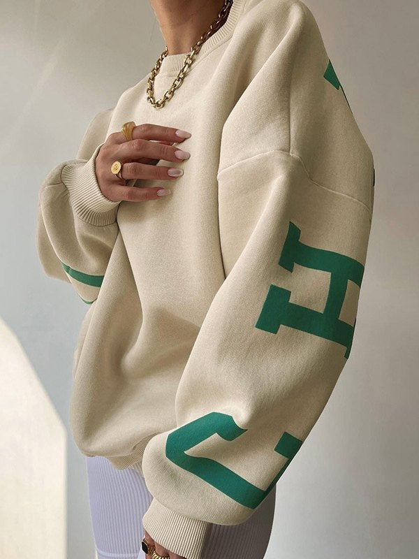 Oversized varsity sweatshirt with green letter graphic